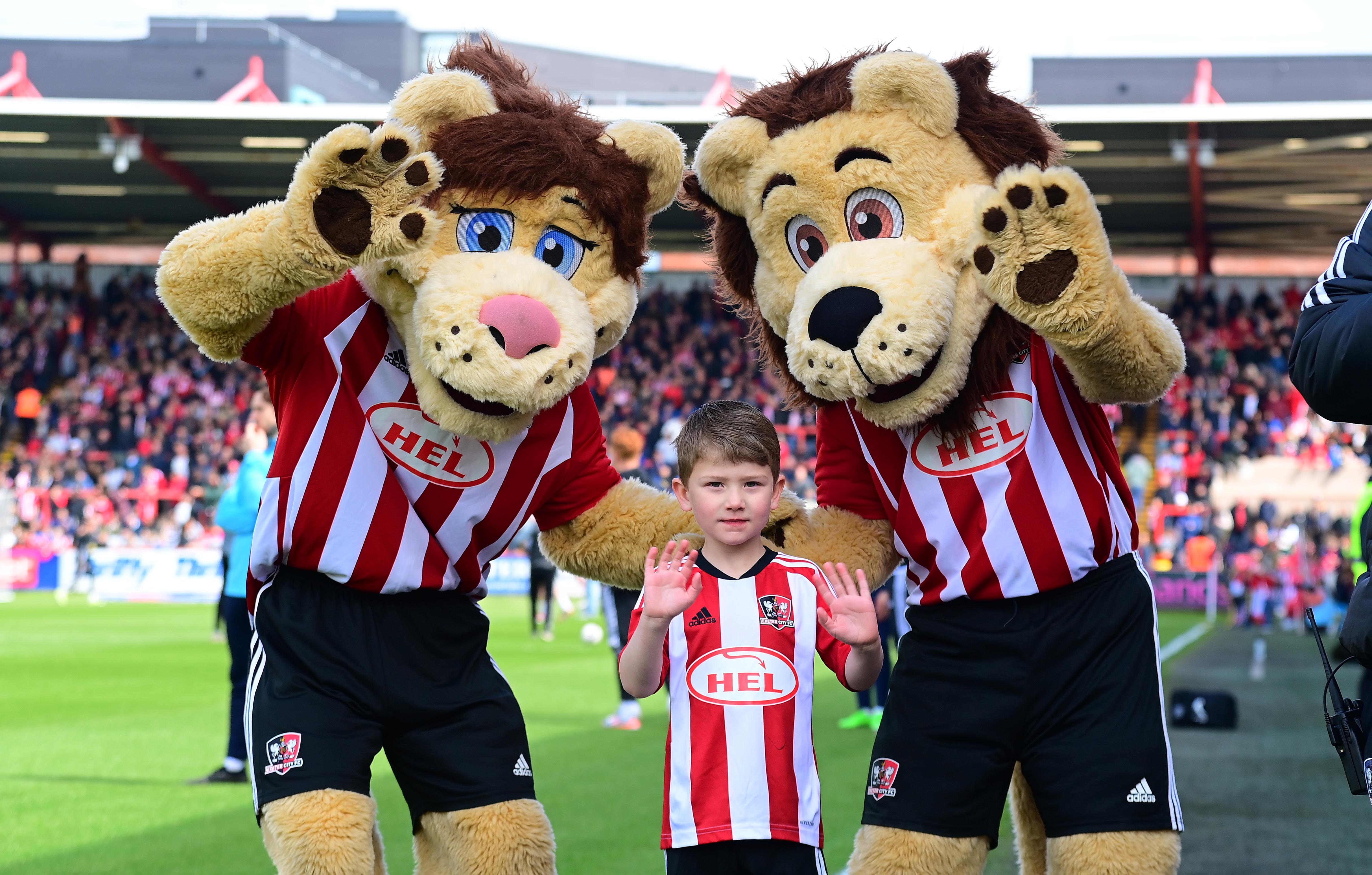 Grecian and Lexi the Lions with a young fan